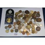 A quantity of foreign and pre decimal coinage including threepenny bits, Victorian penny, Austrian,