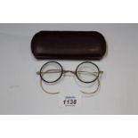 A pair of vintage reading Glasses in tortoiseshell and yellow metal frames by Algha,