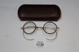 A pair of vintage reading Glasses in tortoiseshell and yellow metal frames by Algha,