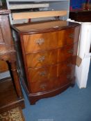 A contemporary bow fronted Walnut/Mahogany Chest of four long Drawers,