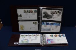 Two folders of Royal Mail First Day Covers from 1993-1998.