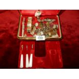 A musical jewellery box and contents including brackets, polished stone stud earrings, etc.