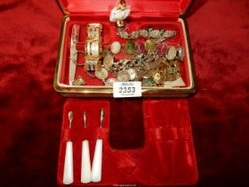 A musical jewellery box and contents including brackets, polished stone stud earrings, etc.