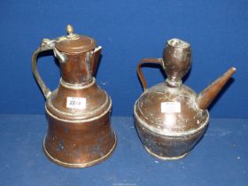 A copper kettle and large copper jug both in middle Eastern design.
