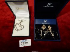 A 925 Silver open heart pendant on chain and two pairs of Swarovski earrings[ clip on ]