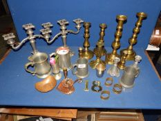A quantity of mixed metals including various brass candlesticks some a/f a pair of pewter