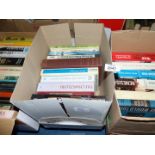 Three boxes of books to include Air War over Korea, Americans in Paris, How Parliament Works,