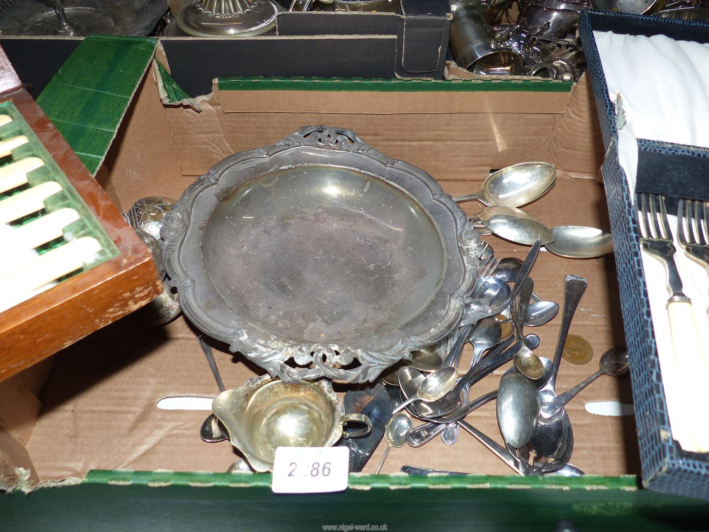 A quantity of plated cutlery including two cased sets of fish eaters, serving spoons, dish, etc.