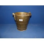 A brass bucket, 9" tall.