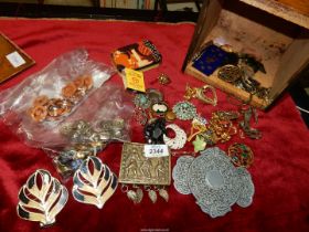 A Raiswell's 5lb Tea box containing miscellaneous contents including buttons, brooches, buckles,