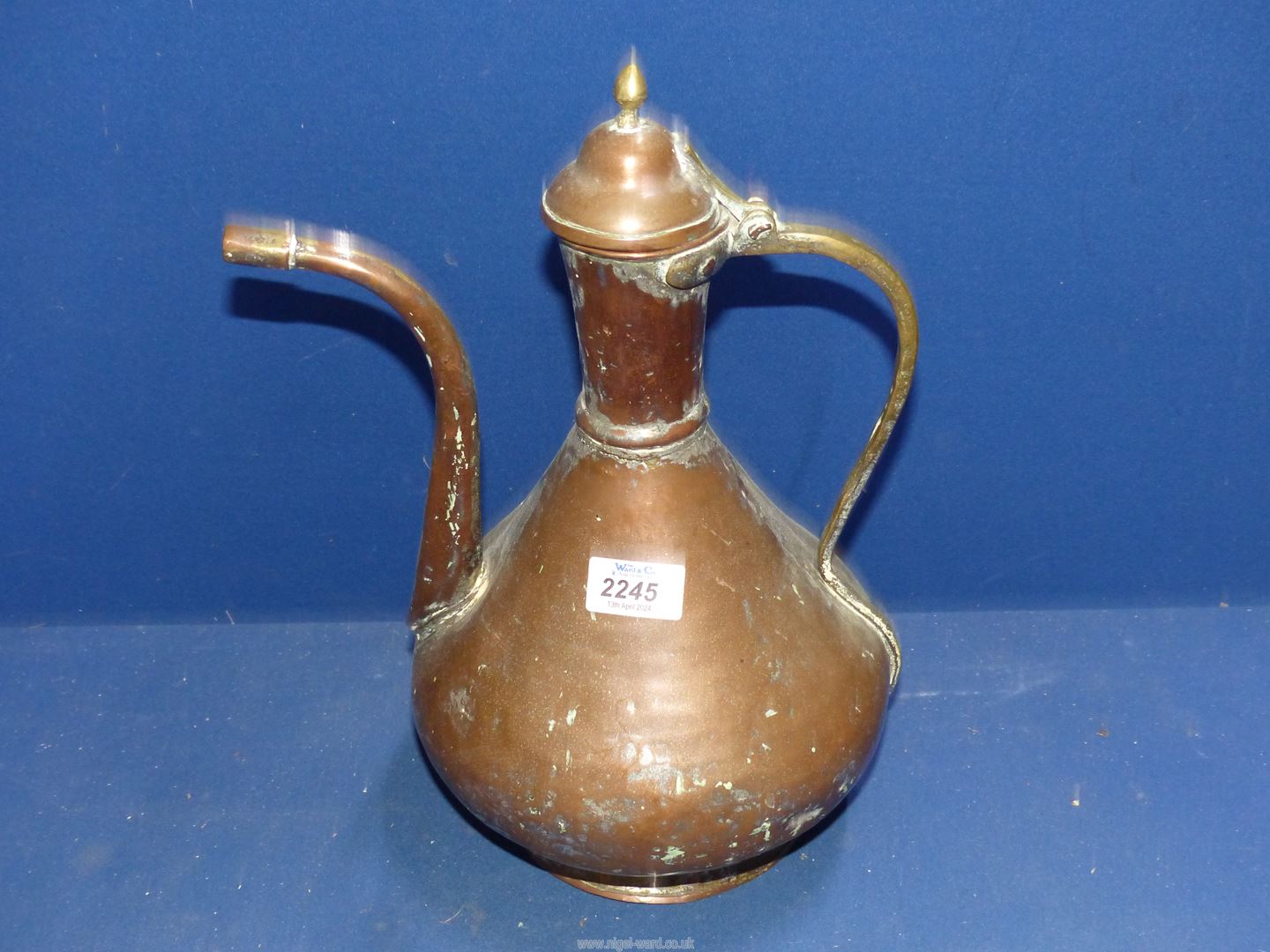 A large copper kettle in middle Eastern design, 14" tall.