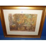 A framed and mounted Watercolour depicting a woodland scene with figures on a bridge,