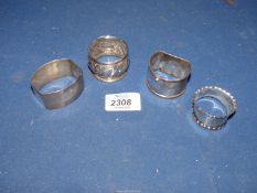 Four silver Napkin rings; two Sheffield and two Birmingham (some dents).
