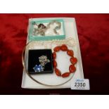 A quantity of jewellery including a 925 torc necklace, a garnet pendant, a 925 bracelet,