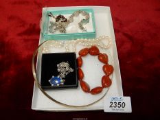 A quantity of jewellery including a 925 torc necklace, a garnet pendant, a 925 bracelet,