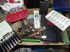 A quantity of cutlery (some cased) including teaspoons, serving spoons, fish eaters,