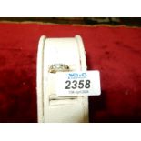 *** A ladies 9ct gold ring with[ five old cut white set stones] ,