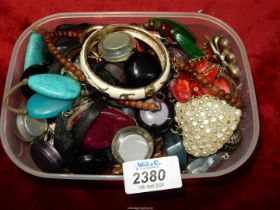 A quantity of costume jewellery including; bangles, heart pendant, chunky necklaces, etc.