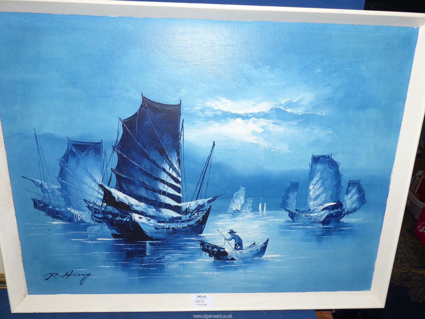 A white framed oriental Oil on board of Junk boats in blue tones, signed lower left, - Image 3 of 3