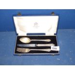A cased Silver Christening knife, fork and spoon set, Sheffield, makers Mappin and Webb.