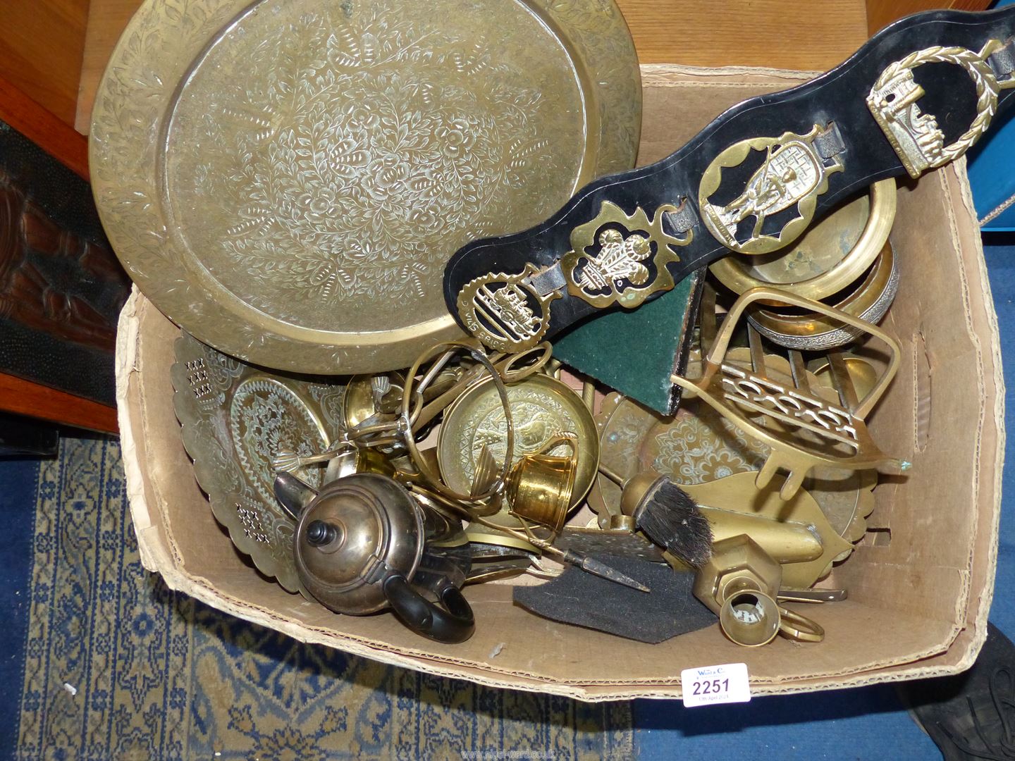 A good quantity of brass and plate including companion set, hot water jug, horse brasses,
