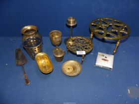 A quantity of brass including; trivets, goblet, cup & saucer, etc.