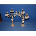 A pair of brass twin branched Candlesticks with flame finial's, a/f 17" tall.