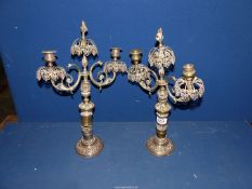 A pair of brass twin branched Candlesticks with flame finial's, a/f 17" tall.