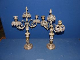 A pair of brass twin branched Candlesticks with flame finial's, a/f 17" tall.