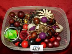 A quantity of costume jewellery including; owl pendant, chunky bead necklaces, etc.