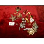 A quantity of costume brooches, including filigree coloured stone, Peacock, push bike etc.