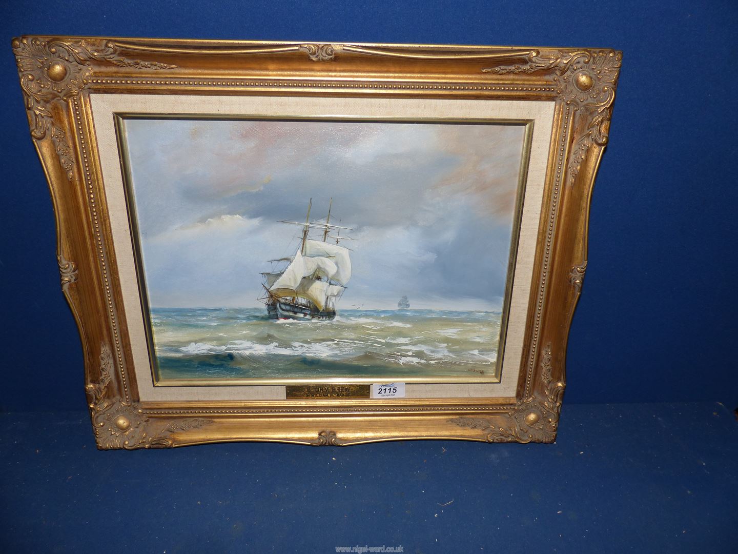 A gilt framed Oil on canvas titled 'Storm Brew' by William Isaacs, signed lower right,