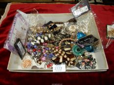 A box of costume jewellery including pendants, bracelets, necklaces etc.