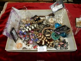 A box of costume jewellery including pendants, bracelets, necklaces etc.