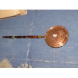 A Copper warming pan.