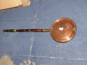 A Copper warming pan.