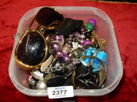 A quantity of costume jewellery and watches including; teddy bear pendant, bangles, etc.