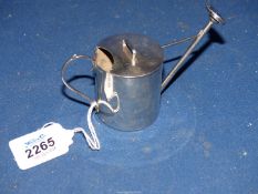 A Silver miniature Watering Can, Birmingham 1910 having some dents 69 gm.