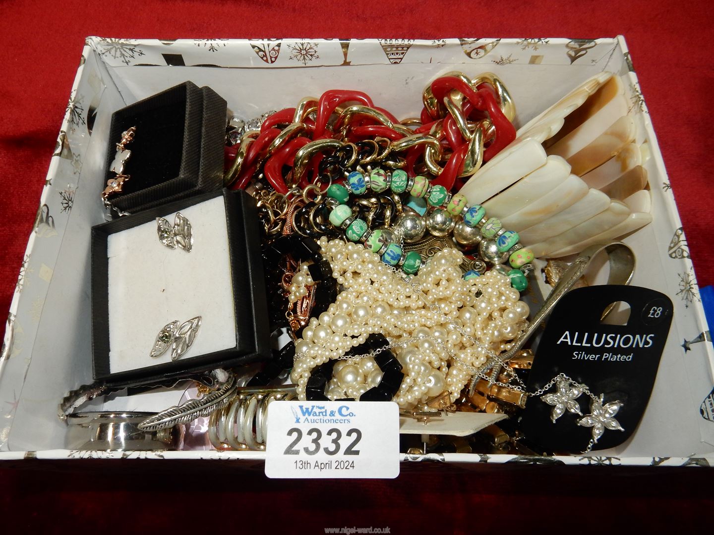 A box of costume jewellery including earrings, bracelets etc.