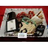 A box of costume jewellery including earrings, bracelets etc.