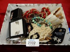 A box of costume jewellery including earrings, bracelets etc.