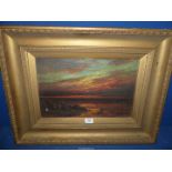 A heavy gilt framed Oil on canvas depicting Seascape at sunset, signed lower right R.C.