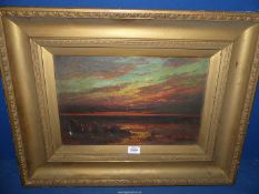 A heavy gilt framed Oil on canvas depicting Seascape at sunset, signed lower right R.C.