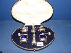 A cased Silver Cruet set (non-matching) complete with liners, the salt & pepper - Birmingham,