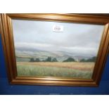 A framed E.J. Wilson painting, signed lower left, depicting The Brecon Beacons, 16 1/2" x 12 1/2".