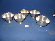 Five sterling silver footed bowls by Wallace : three with shaped edge rims.
