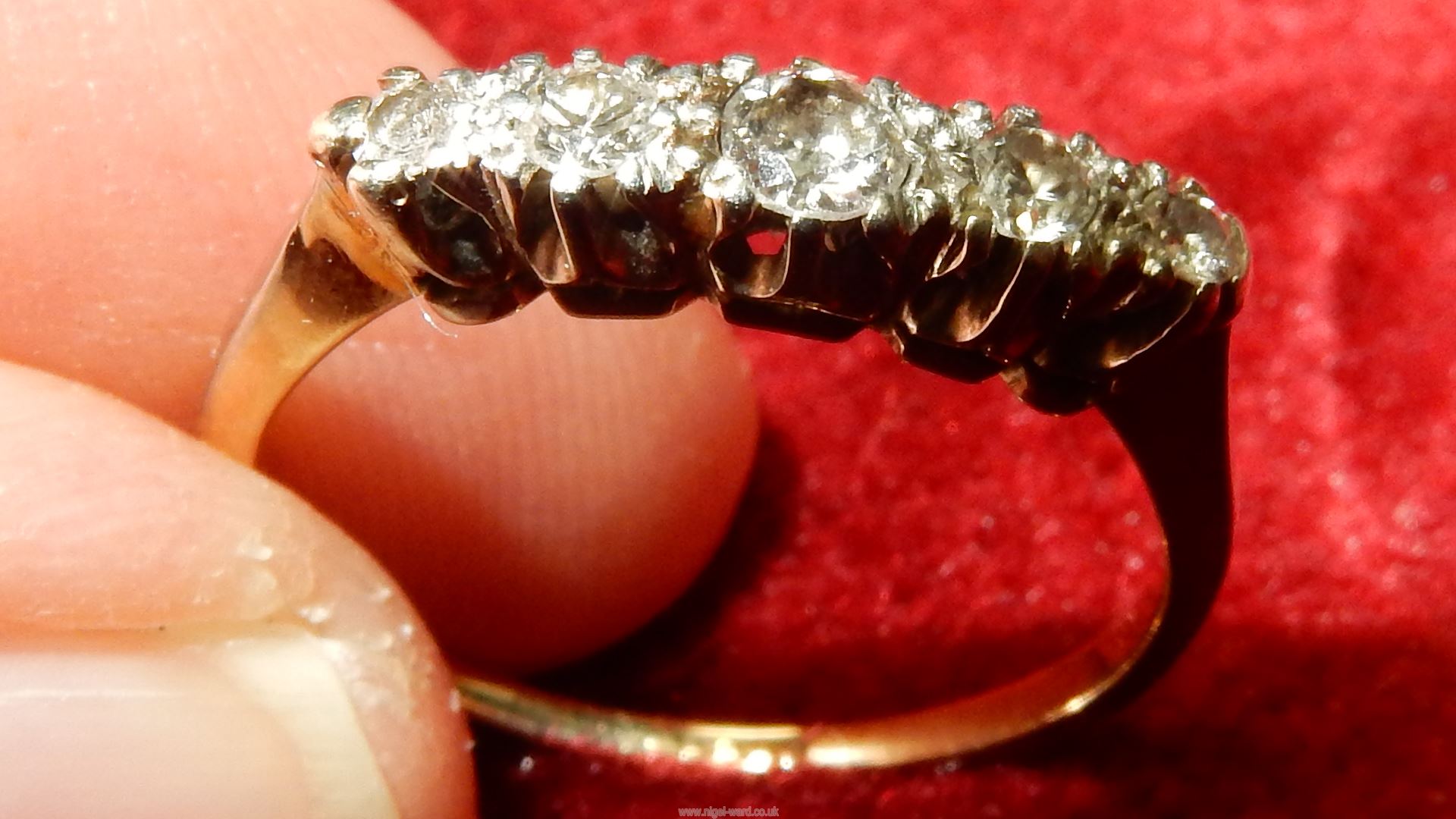 A 18ct Diamond ring having five graduated diamonds. - Image 3 of 10