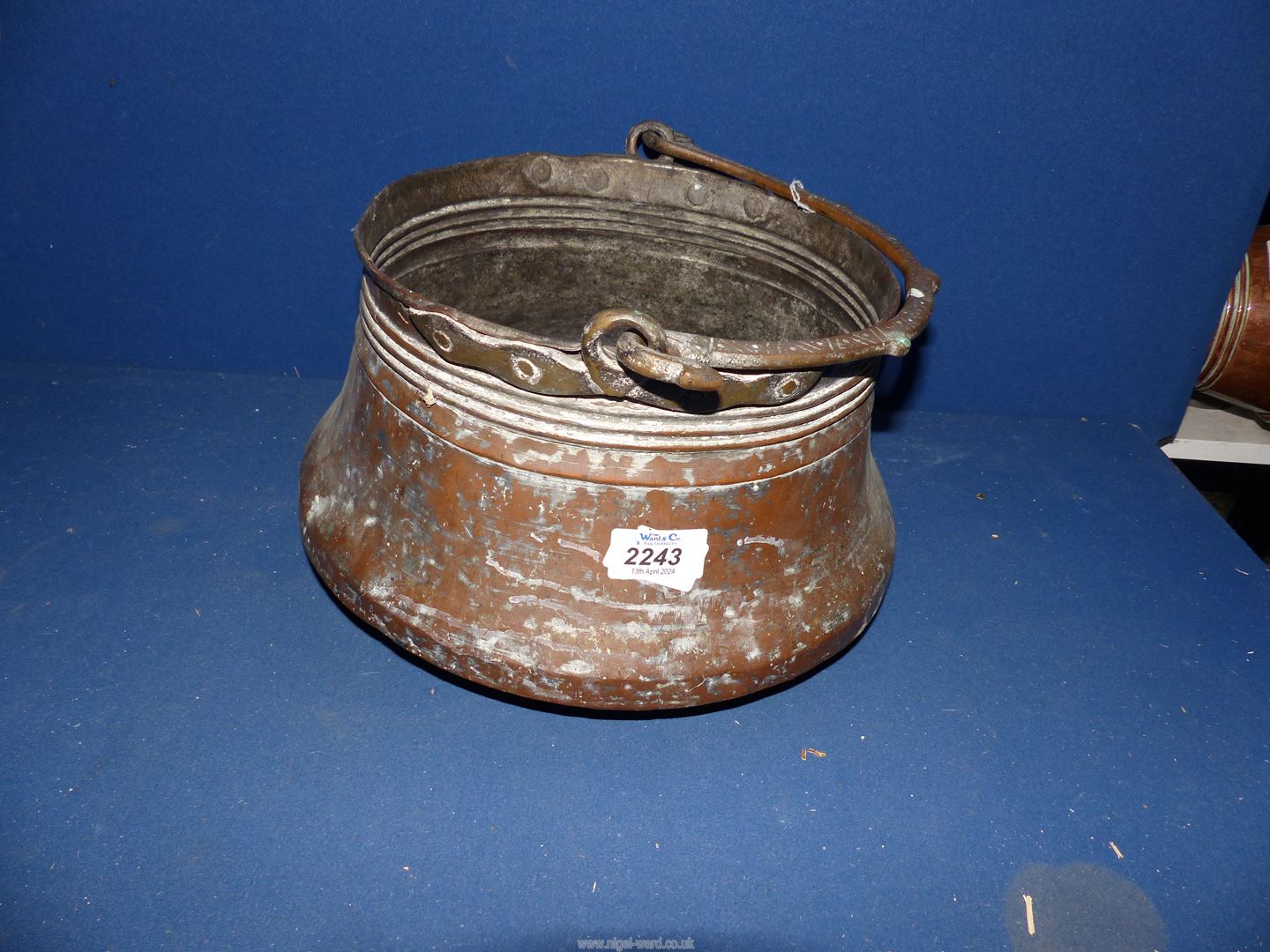 A large copper bucket, 9 3/4" diameter x 6 3/4" high.