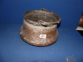 A large copper bucket, 9 3/4" diameter x 6 3/4" high.