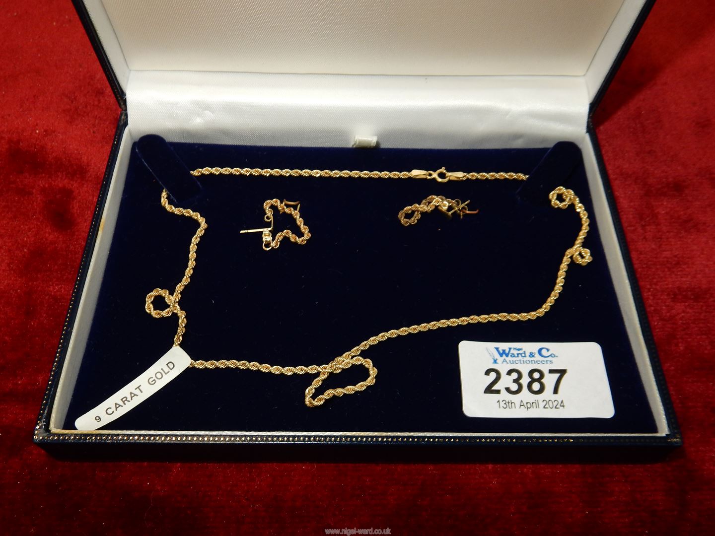 A 9ct gold necklace and earrings set.